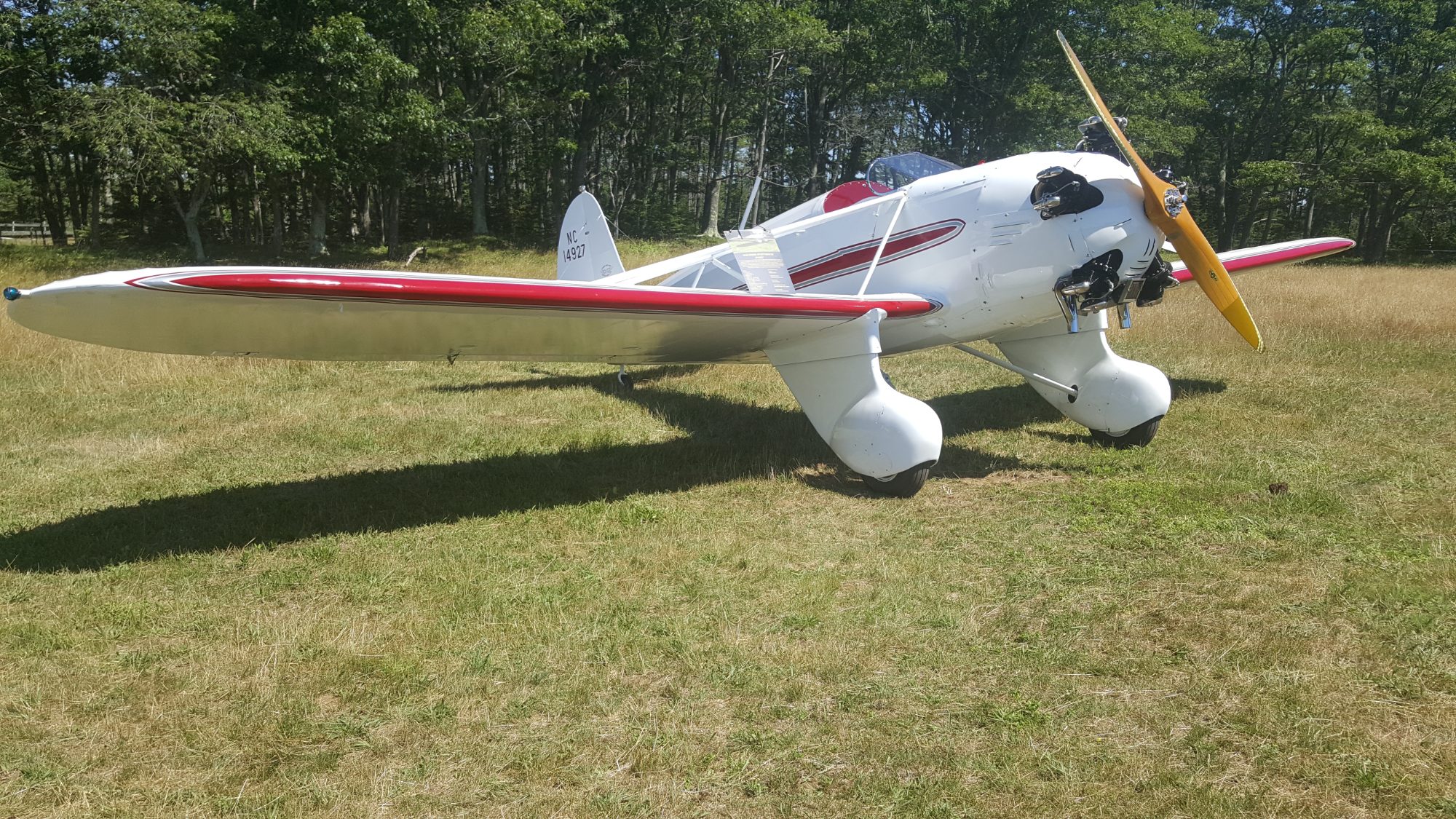 Classic light sport aircraft on a grass field